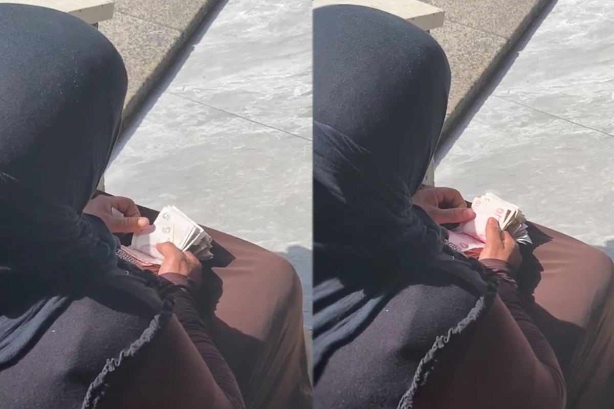 Taksim’de hasılatı sayan dilenci kadın kamerada