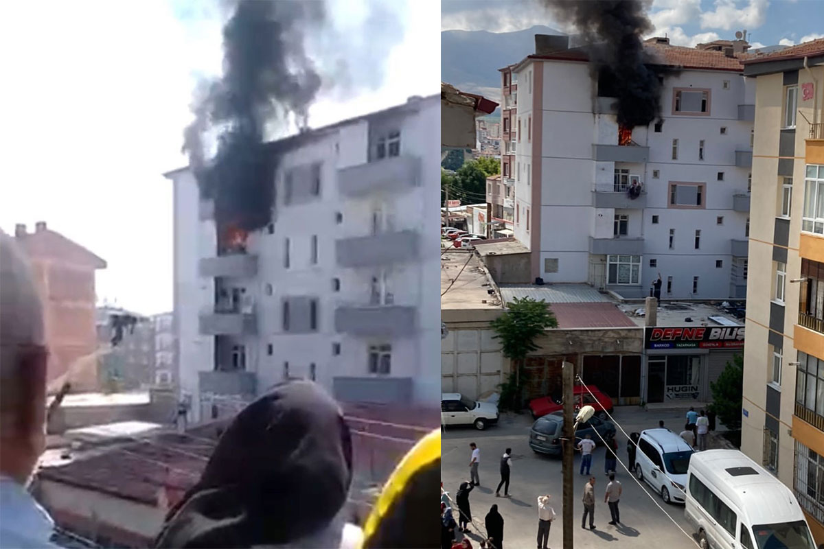 Yangında balkondan atlayan kadını havada tuttu