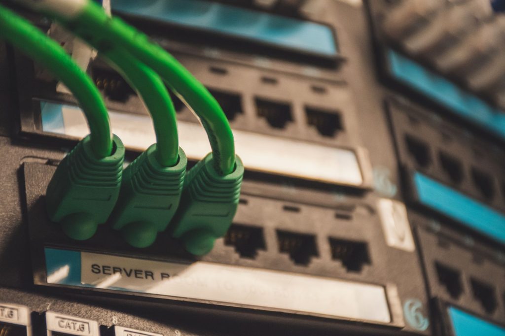 close up of network cables with server ports