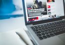 gray laptop computer near journals
